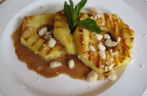 Grilled Pineapple w/ Caramel Sauce & Macadamia Nuts